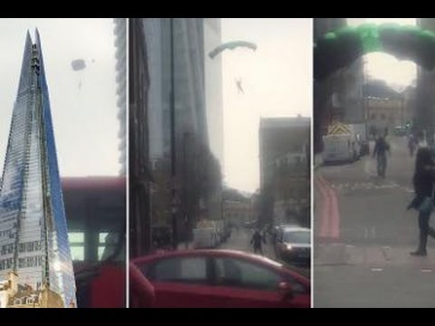 شاهد بالفيديو.. مجهول يقفز بمظلة من أعلى برج بأوروبا و"يختفي" 33537