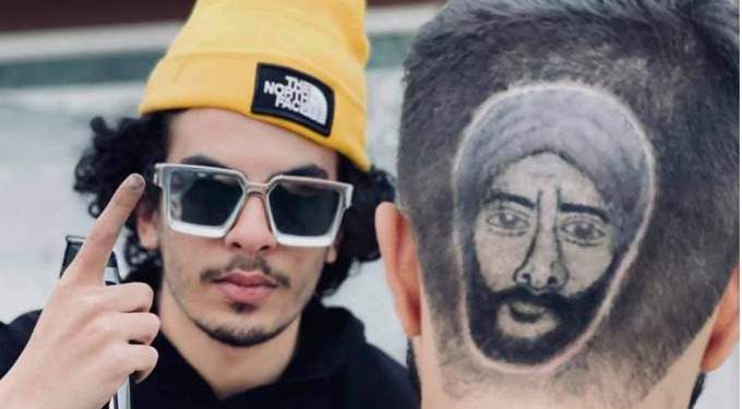 بالصور .. مصفف شعر ليبي يرسم وجه محمد رمضان في مسلسل موسى على رؤوس المعجبين مصفف