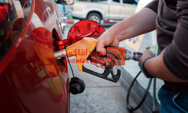 closeup man hands handle tool refueling gasoline pump into red car gas station work1