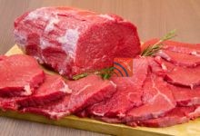 huge red meat chunk steak wood tablel